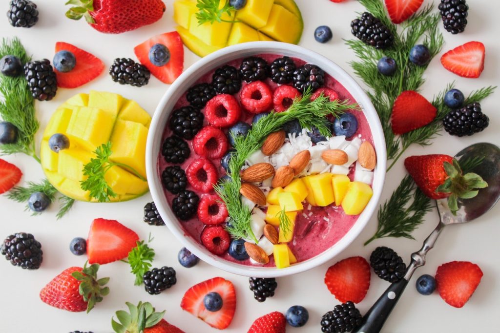 White bowl with a bunch of yummy fruits